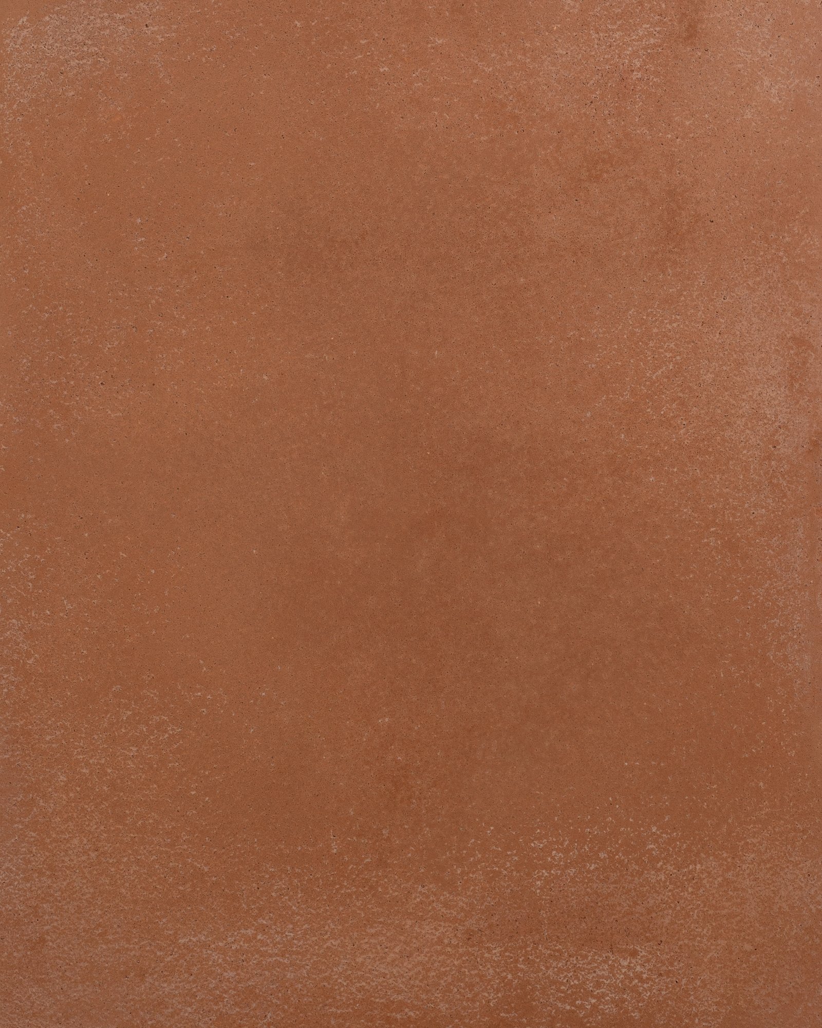 Tadelakt sample swatch in terracotta, burnished to a soft sheen