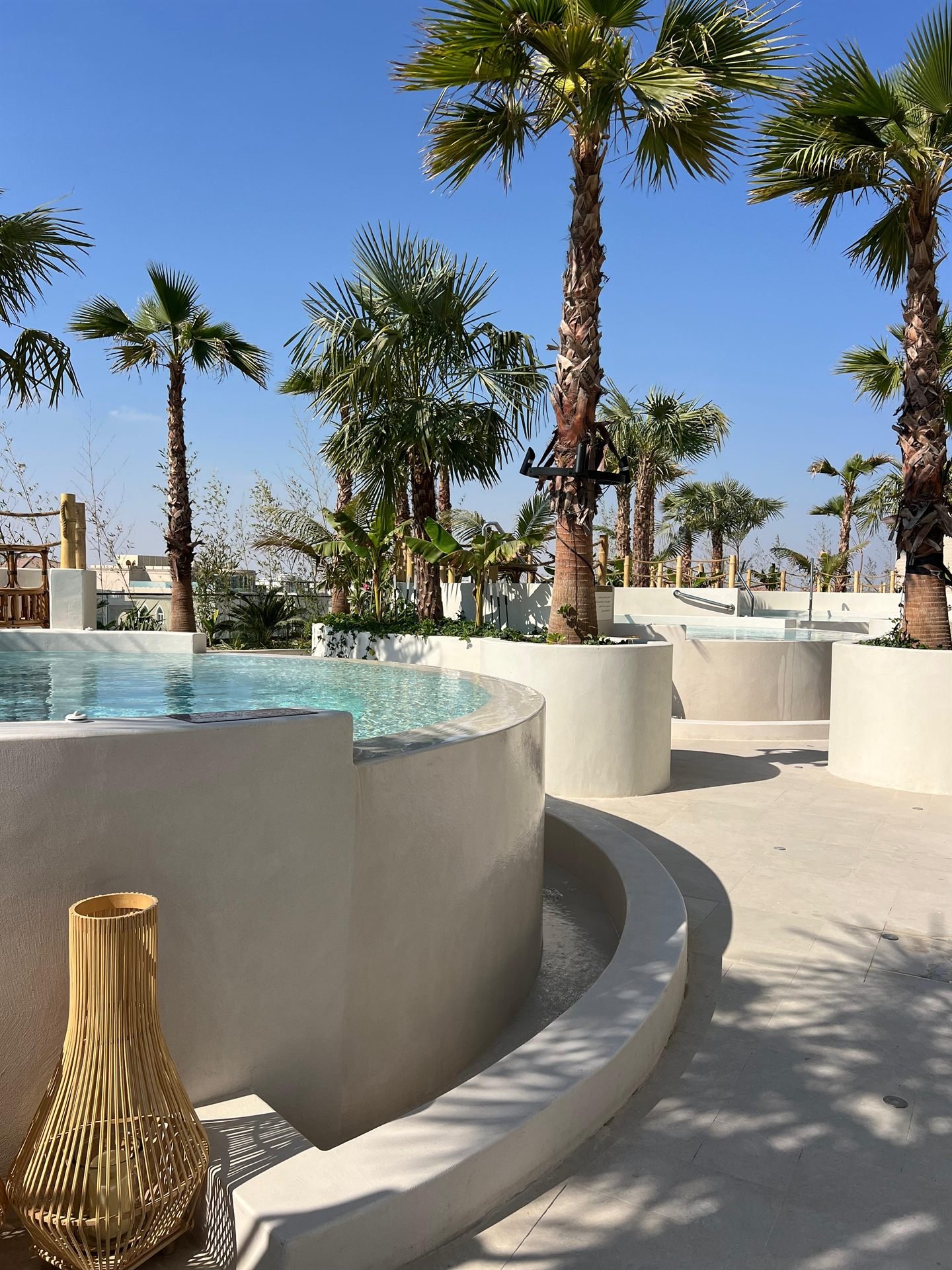 Curved microcement pool surround at The OQ Hotel, Doha