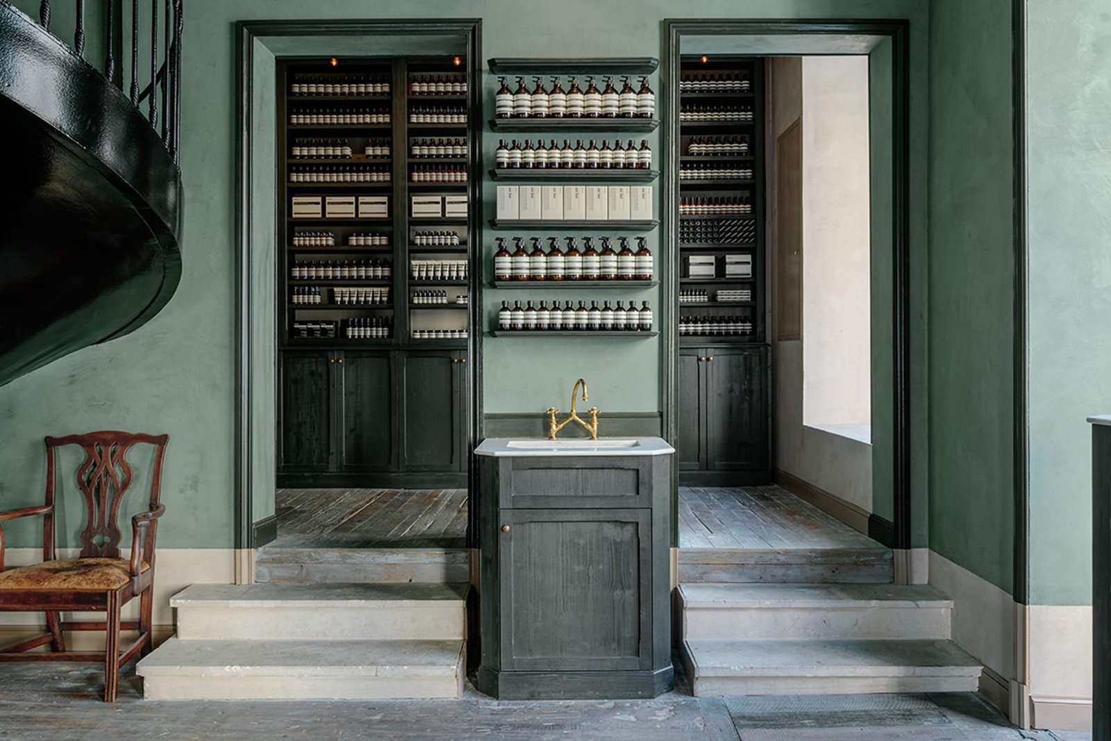 Tonal clay plaster in a custom green at the Aesop store, Bordeaux