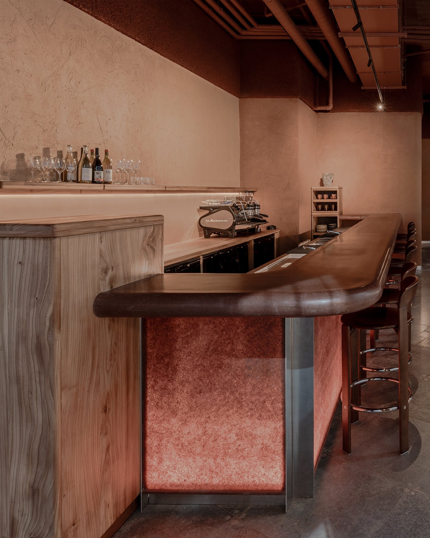 Hand-applied clay plaster wall at Ara, East London.