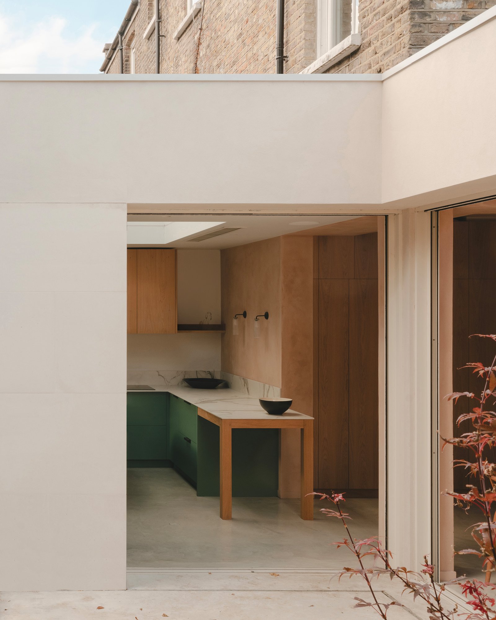 Smooth clay plaster wall and joinery at Balmore House, London.