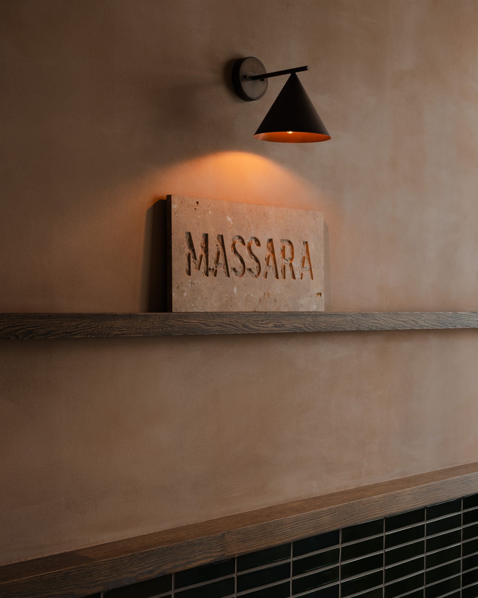Clay plaster against timber and stone at Massara, New York