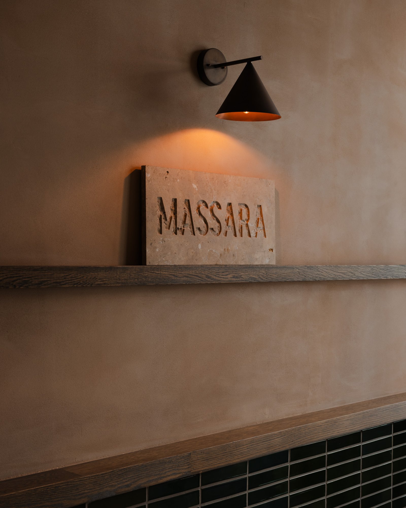 Clay plaster against timber and stone at Massara, New York.