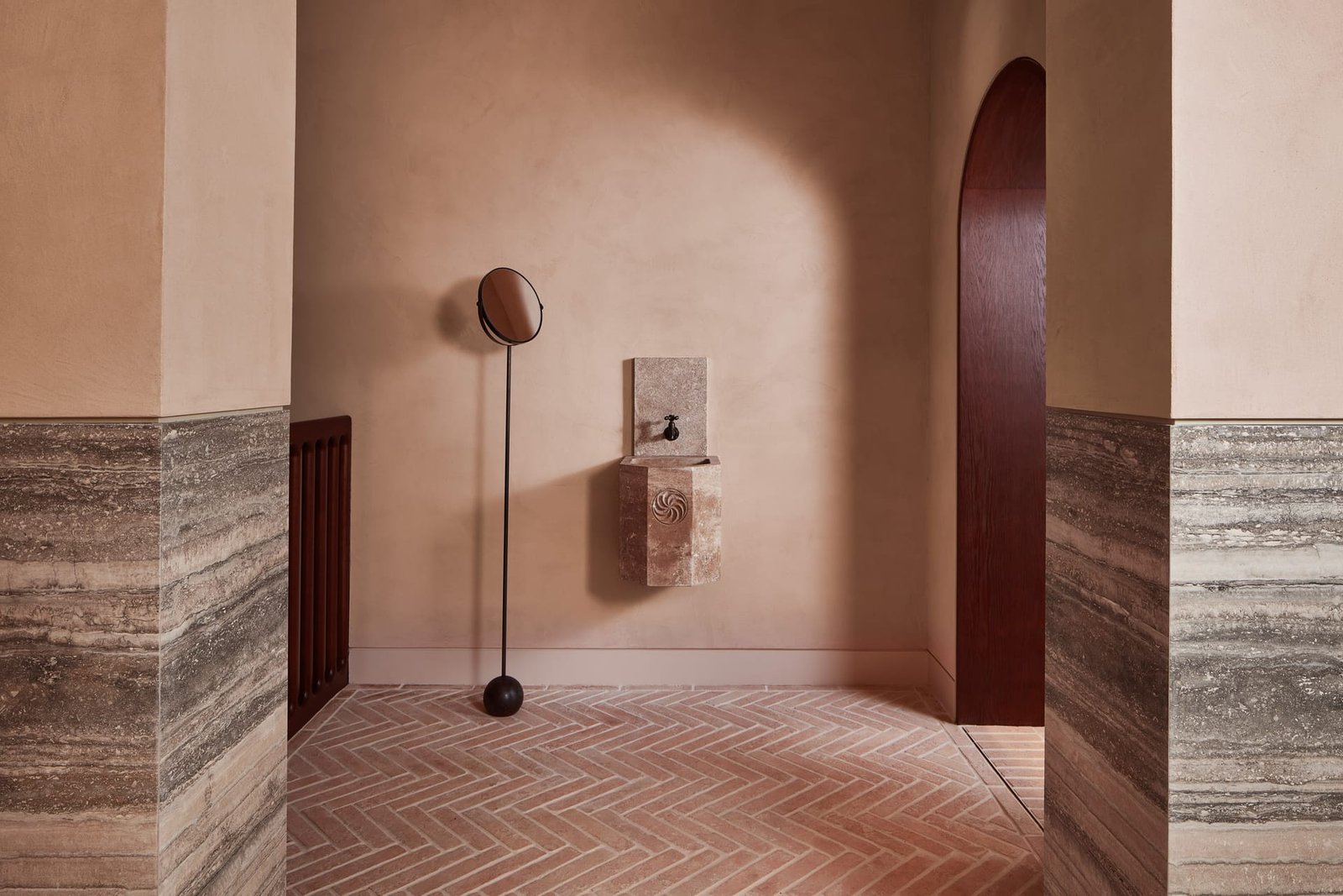 Smooth clay plaster above a travertine dado on the landing, Omorovicza, Mayfair