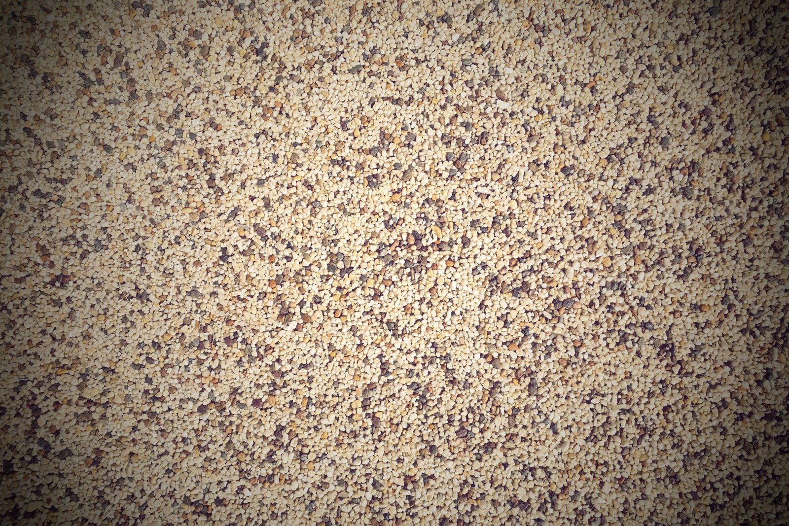 Overhead close-up of Addaset resin bound aggregate paving showing stone locked into a continuous matrix