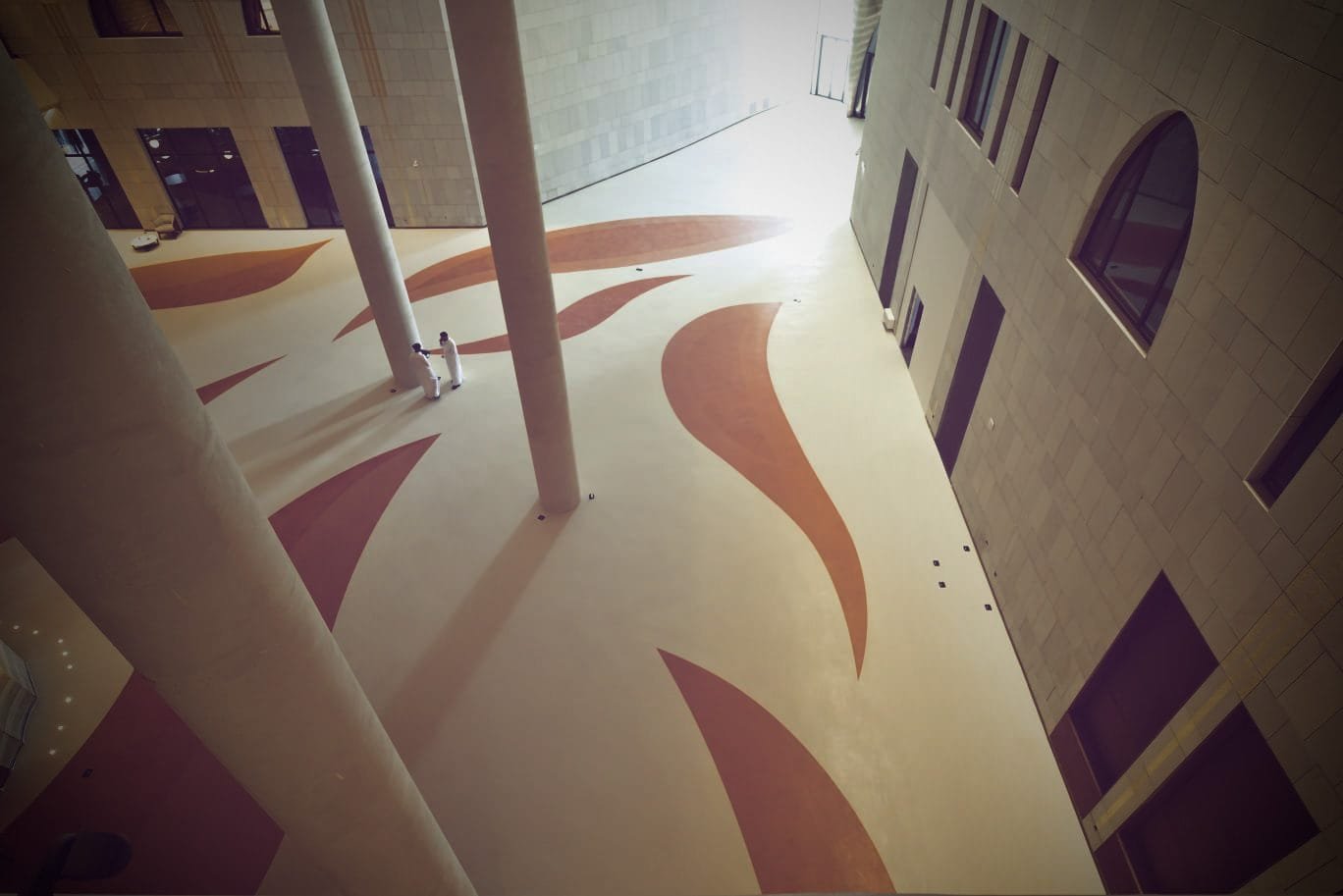 Curved microcement wall planes in the grand hall of the King Fahad Cultural Centre, Riyadh