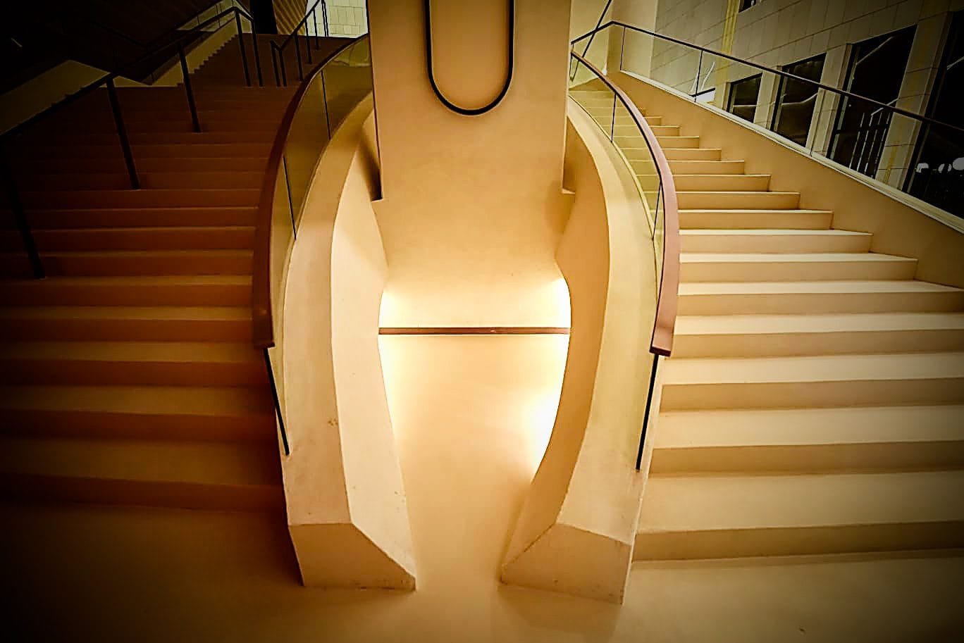 Sculptural microcement staircase balustrade lit from within at the King Fahad Cultural Centre, Riyadh