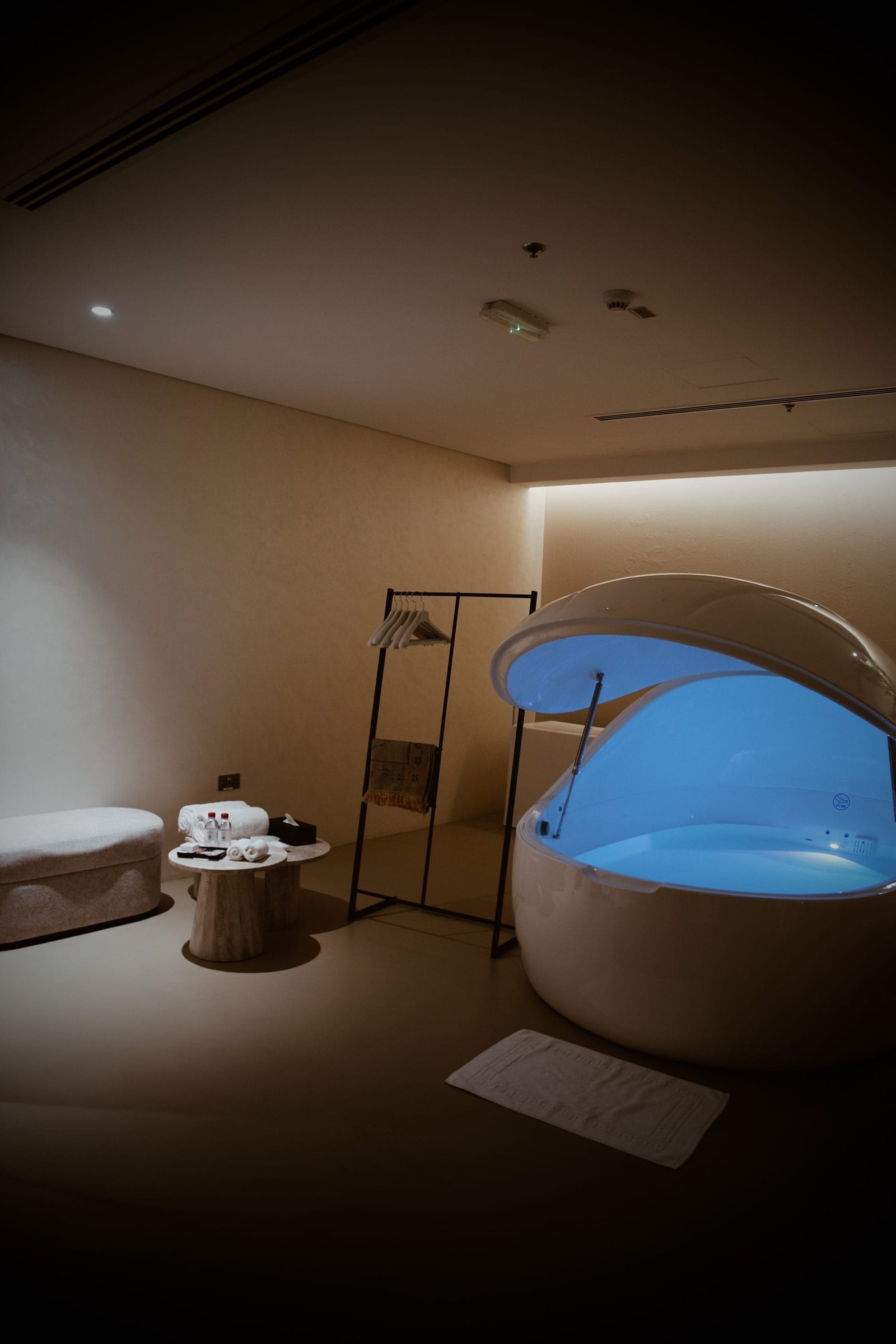 Flotation room lined in seamless microcement with concealed lighting at Katara Hills, LXR Doha
