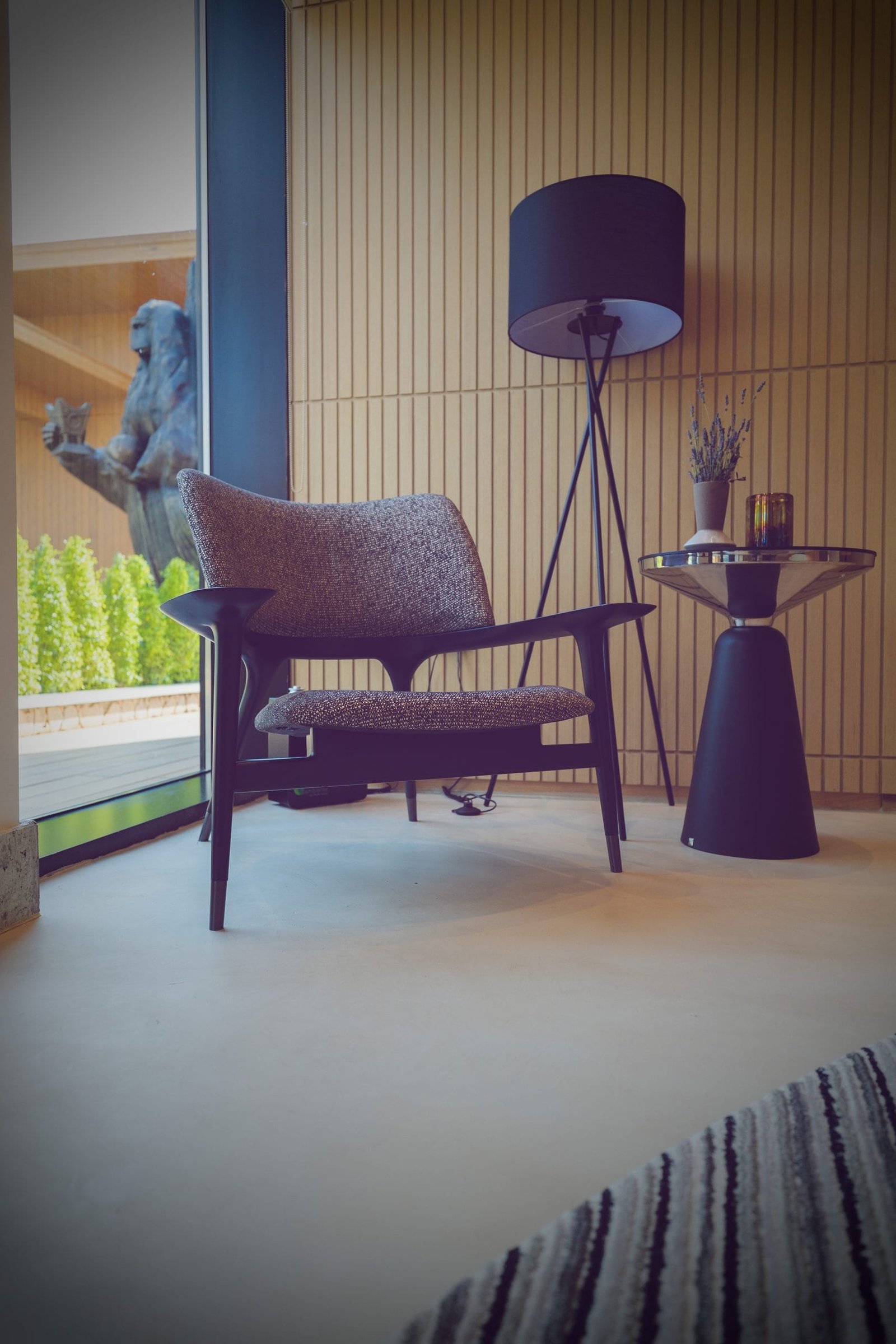 Seamless cream microcement floor in a lounge corner at Katara Hills, Doha