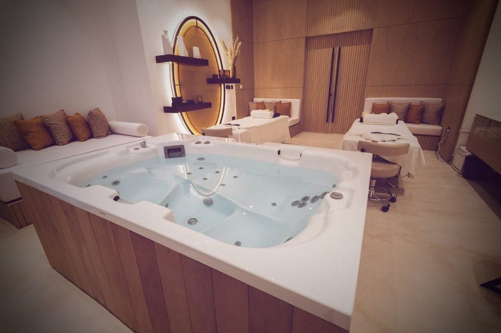 Spa treatment room with seamless microcement walls and floor at Katara Hills, LXR Doha