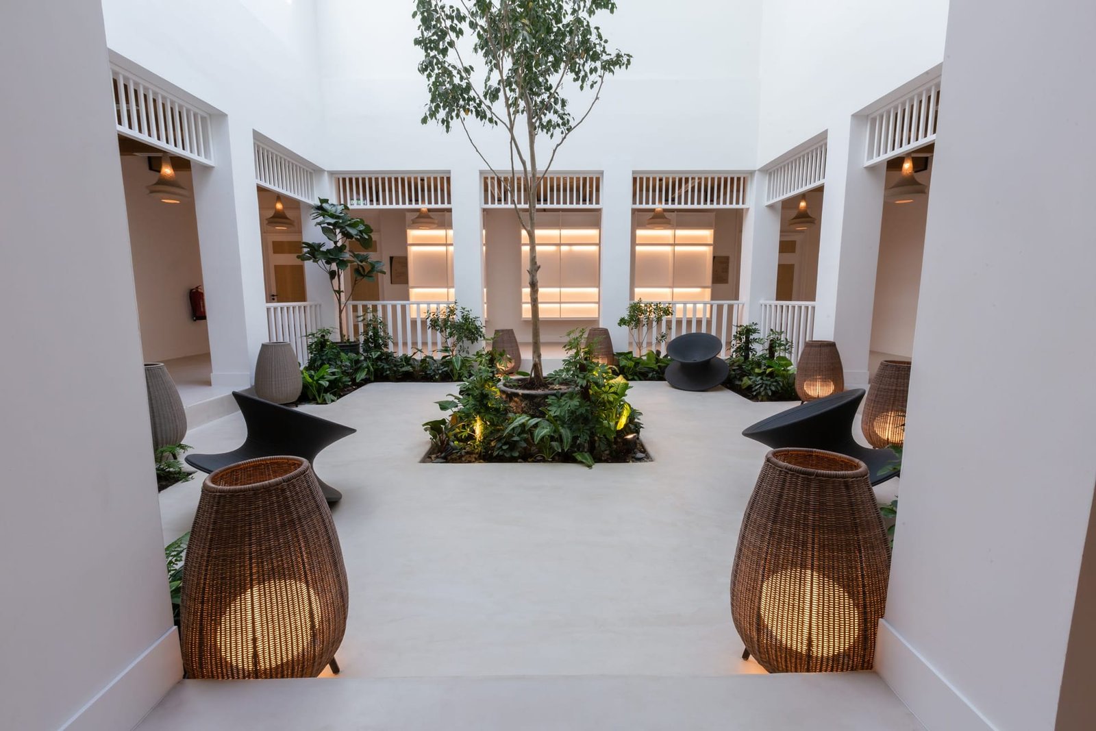 External courtyard with seamless microcement paving and walls at Maysan, LXR Doha