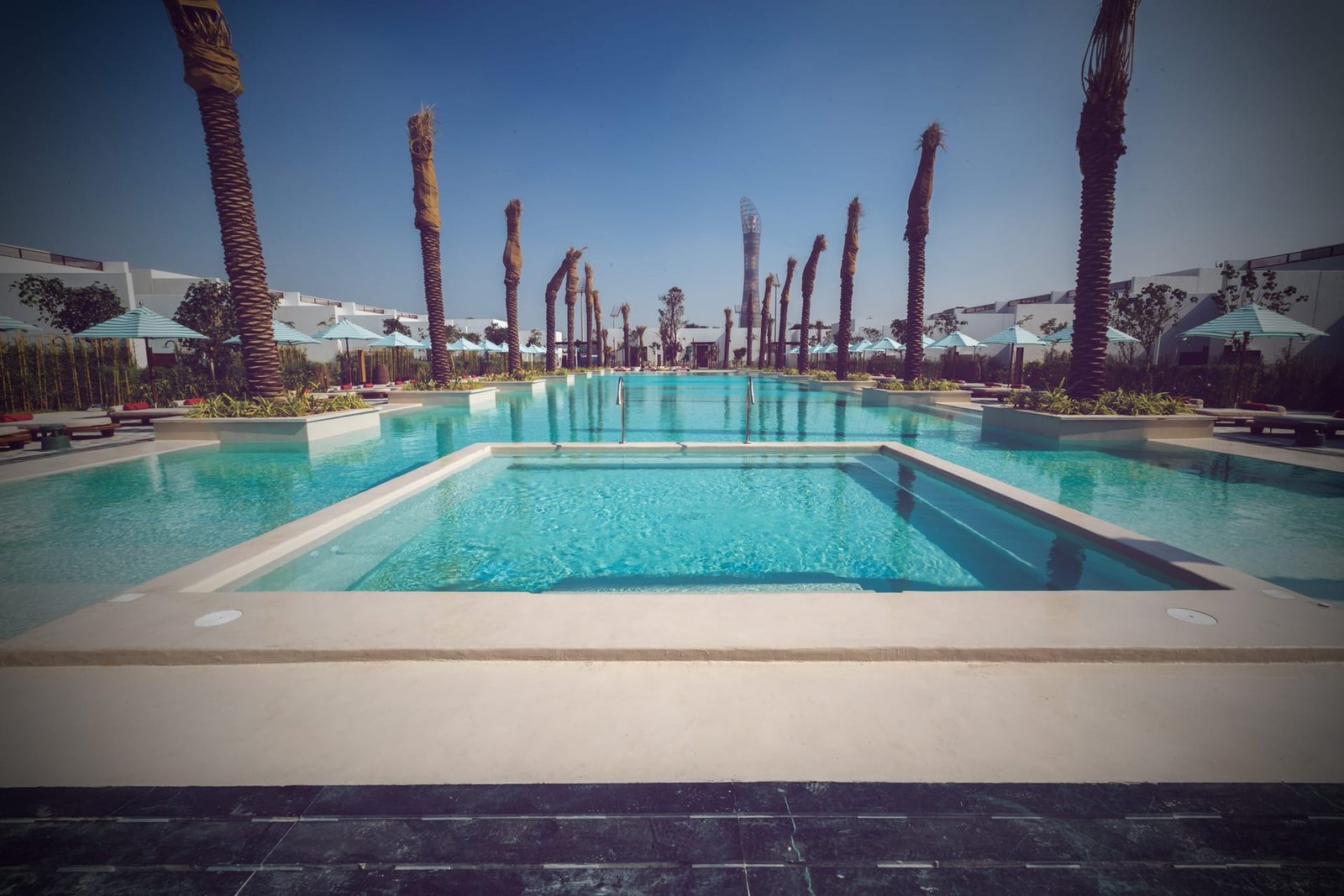 External pool terrace finished in microcement at Maysan, LXR Doha