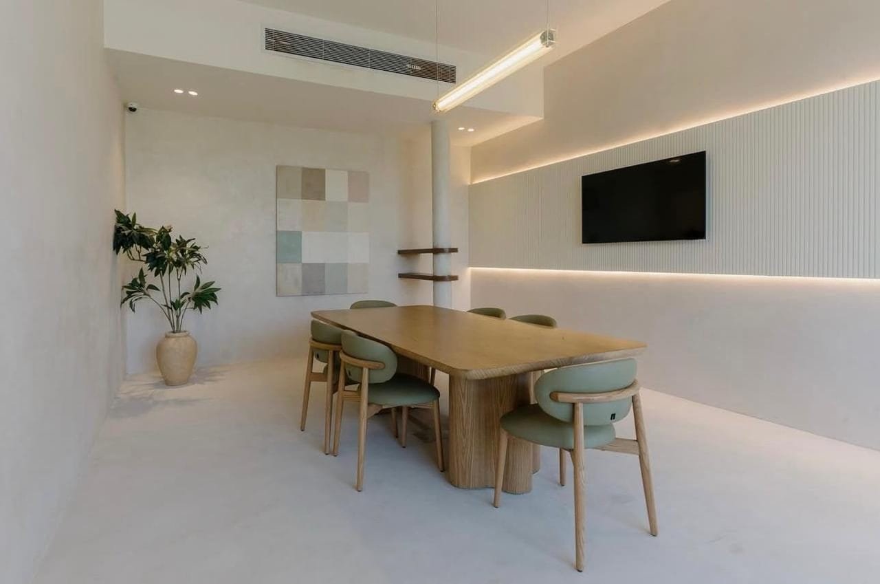 Off-white microcement walls, floor and fluted feature wall in a meeting room, LA7