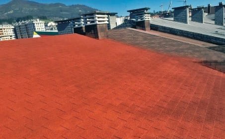Terracotta projected cork coating sprayed seamlessly across a city rooftop